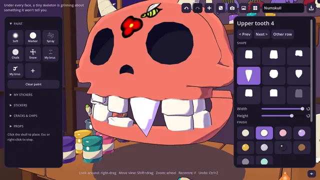 Shaping a single tooth on a red horned skull